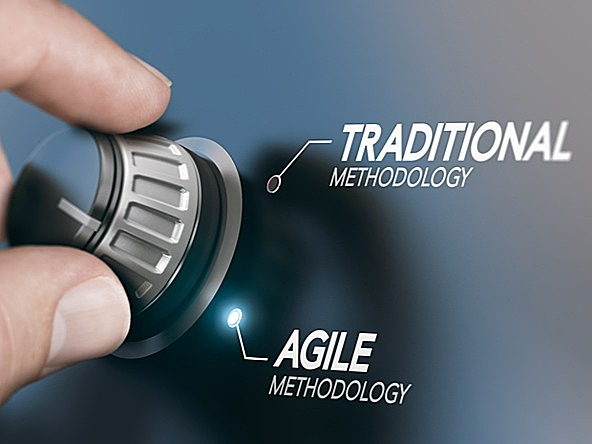 Hand turning dial from traditional to agile methodology